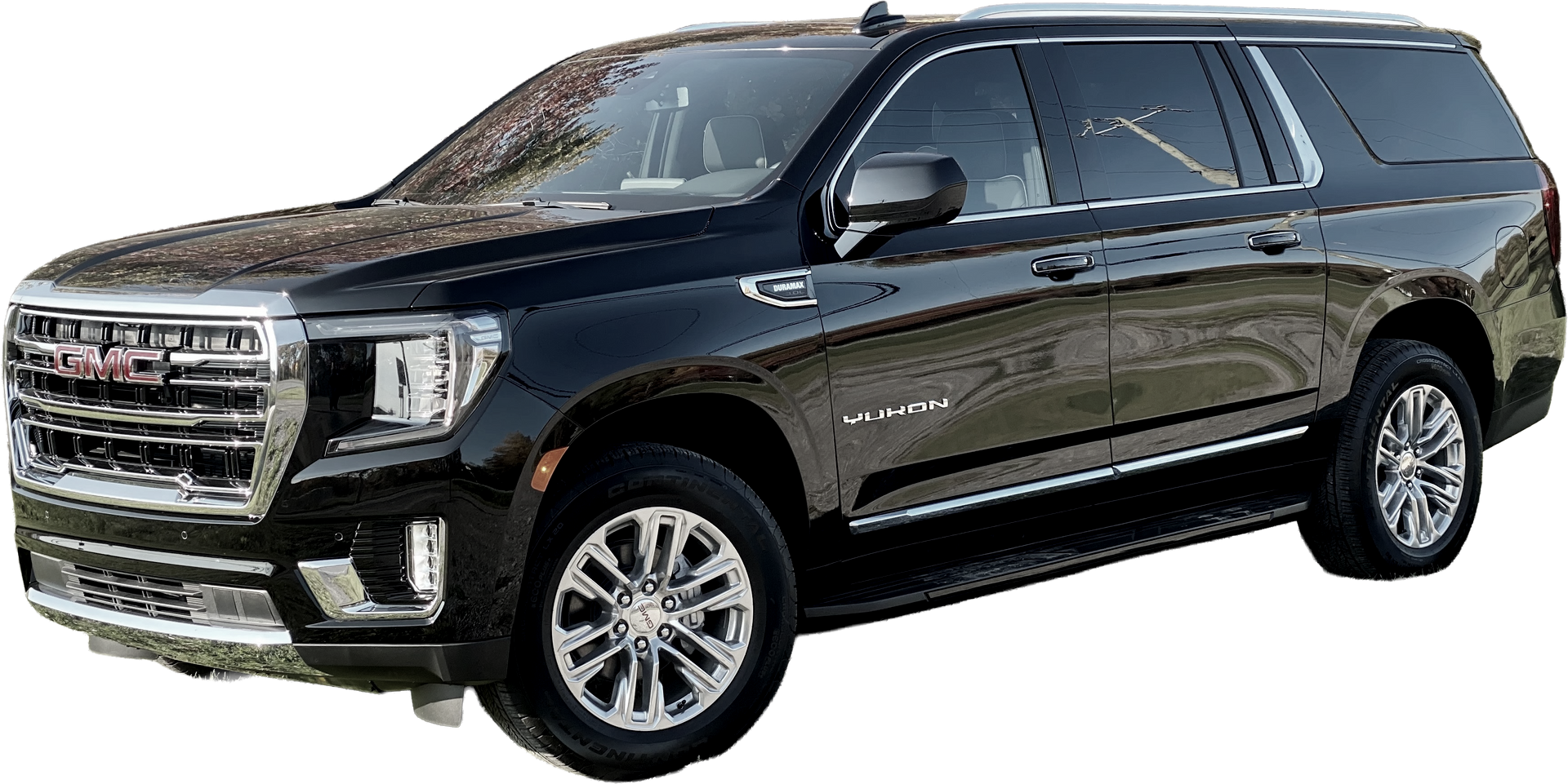 A black chevrolet suburban suv is parked on a white background.