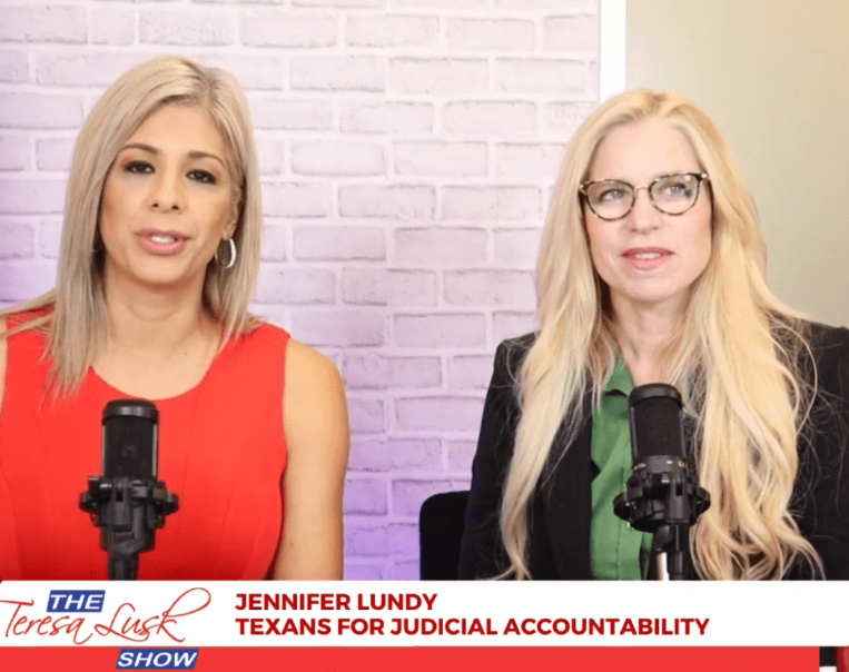 Two women sit at microphones in a studio for The Teresa Lusk Show, with a caption identifying Jennifer Lundy.