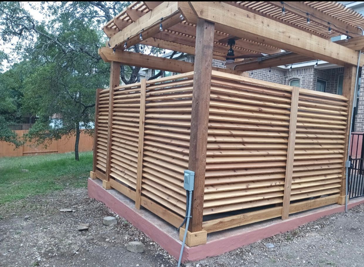A wooden fence with a pergola on top of it