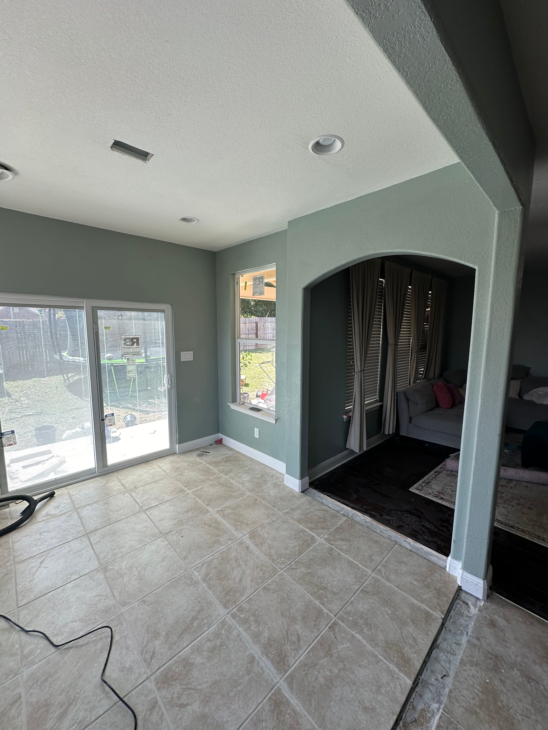 There is a vacuum cleaner in the middle of the room.