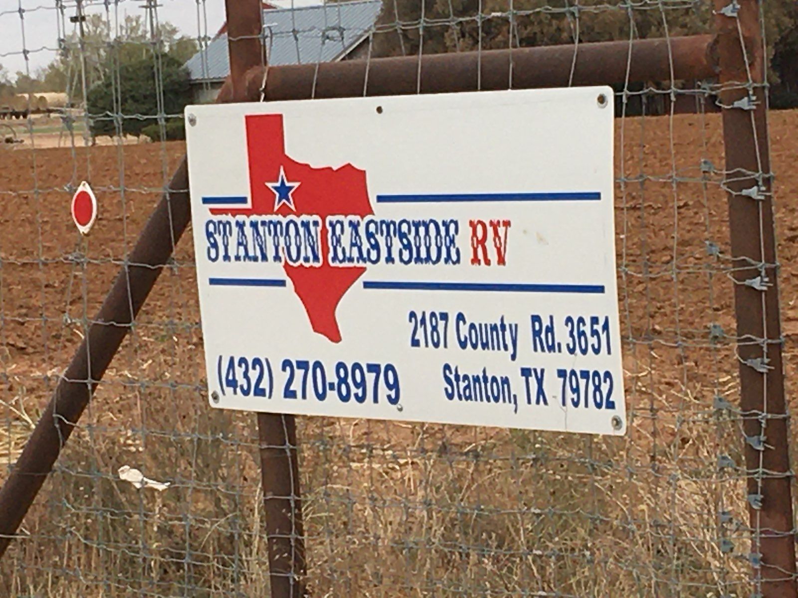 Sign for Stanton Eastside RV, a business in Stanton, TX, with the address and phone number displayed.