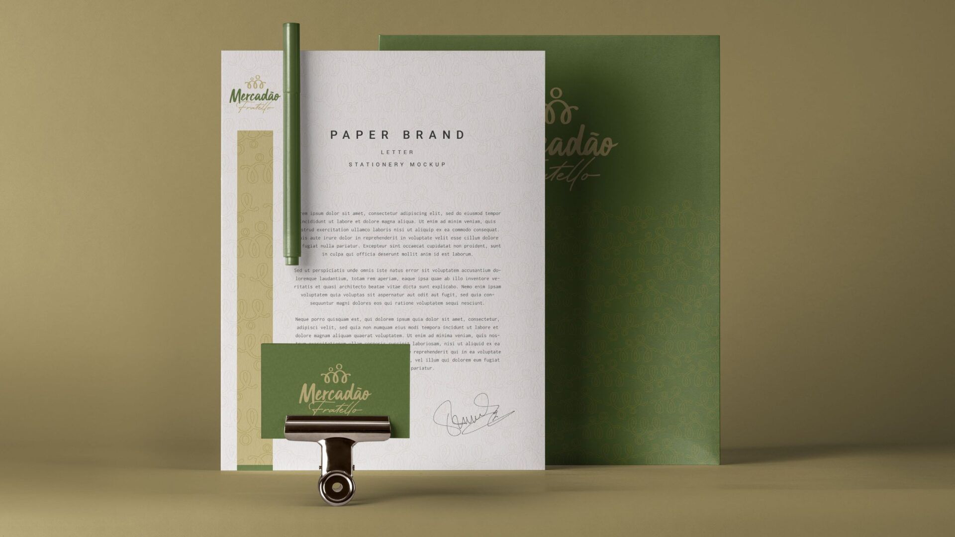 Um modelo de papel timbrado, cartão de visita e caneta.