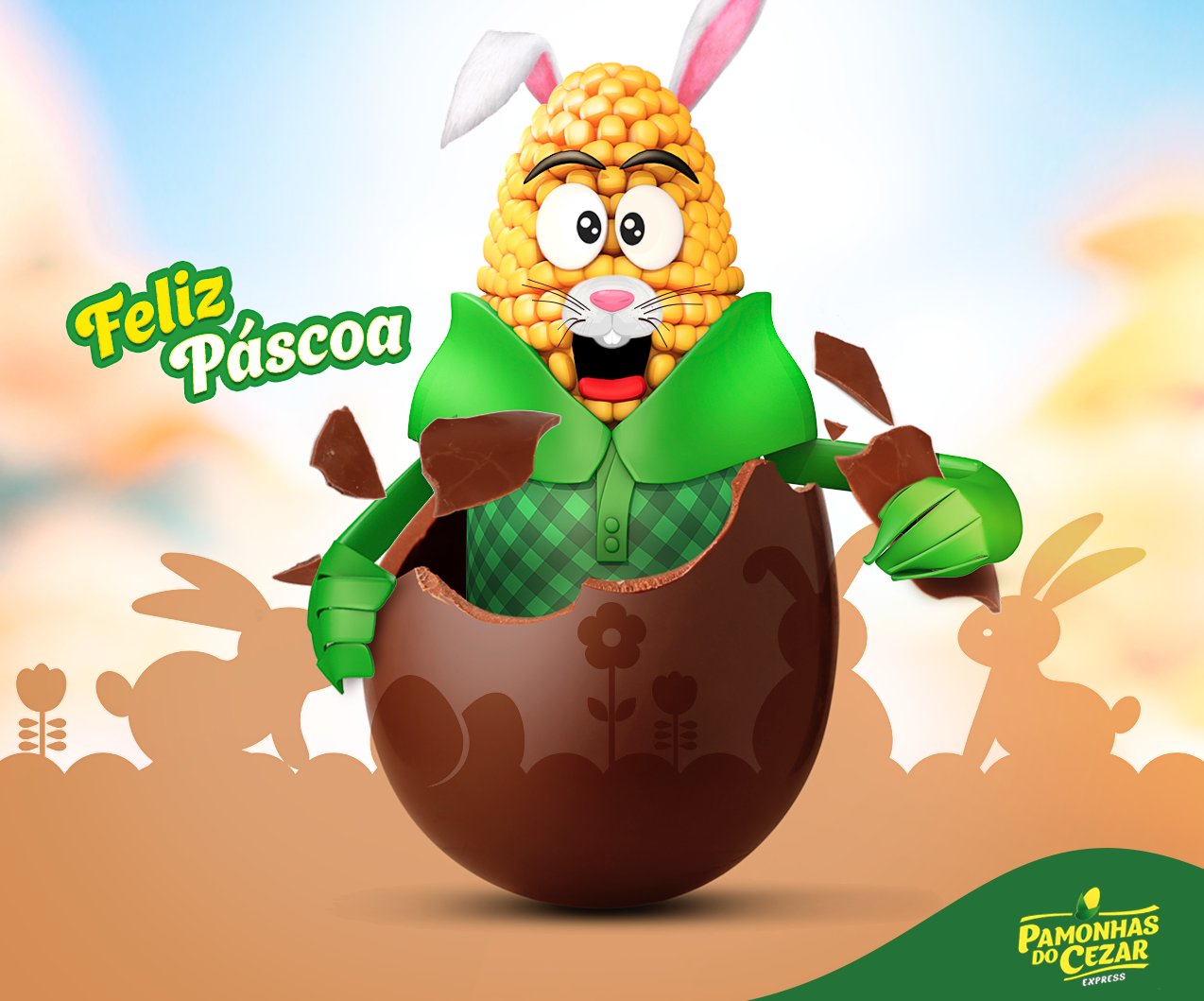 Um coelhinho da Páscoa em formato de milho, vestindo uma camisa verde, sai de dentro de um ovo de chocolate. O texto diz