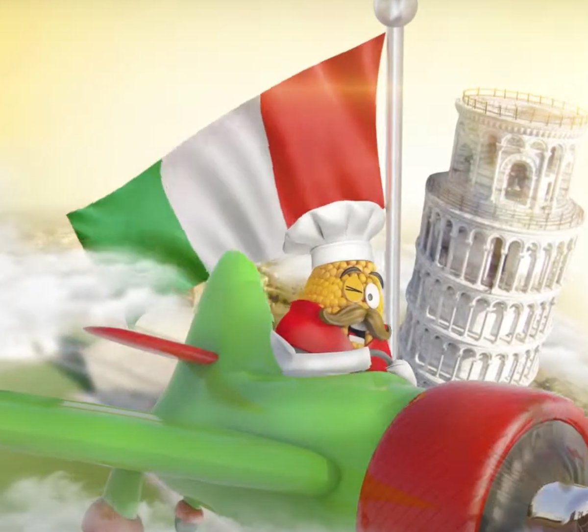 Chef em avião verde, com bandeira italiana e a Torre de Pisa inclinada ao fundo.