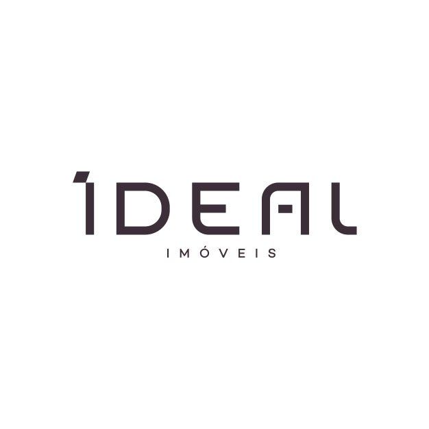 É um logotipo para uma empresa chamada ideal imoveis.