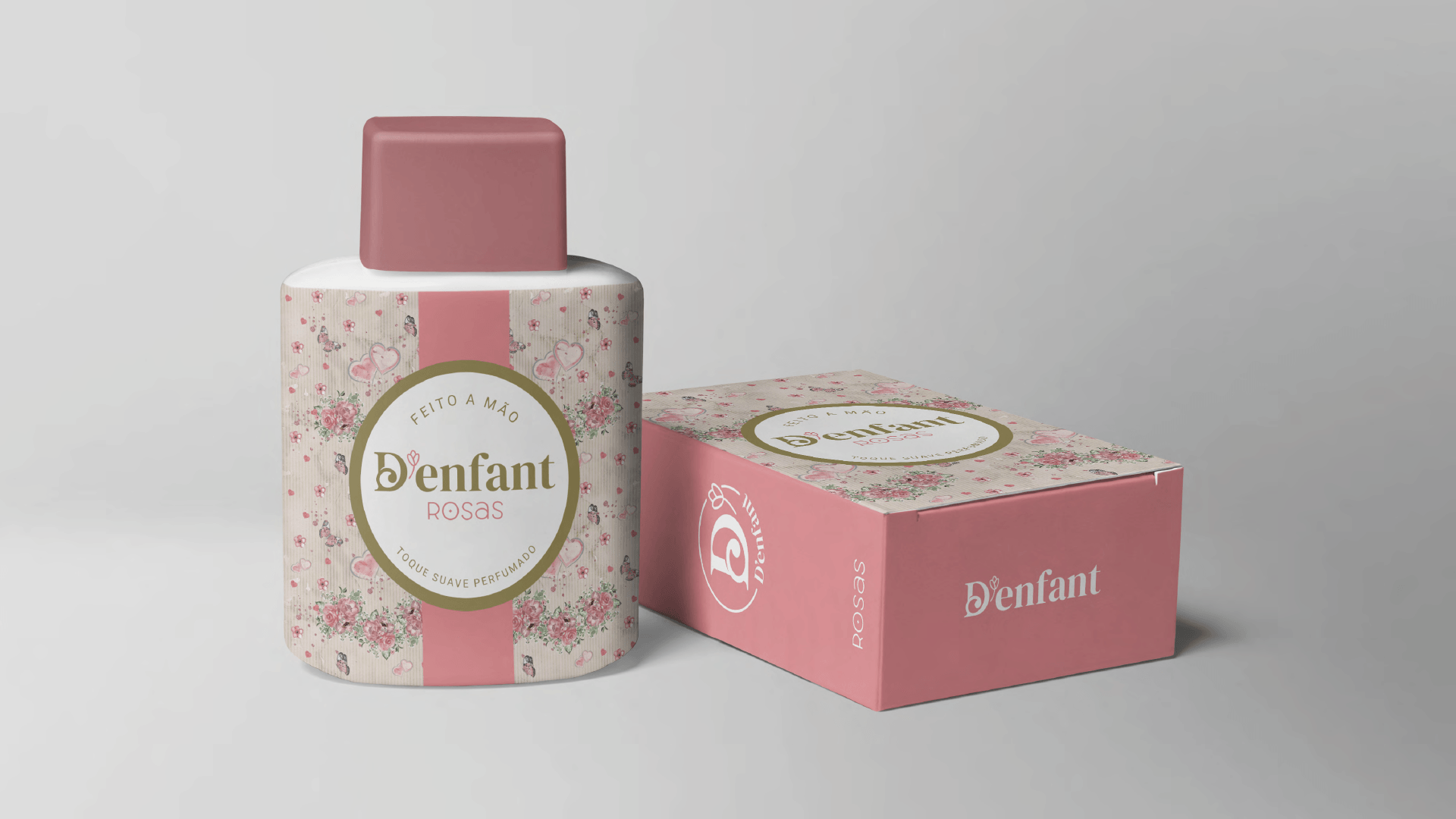 Frasco e caixa de perfume com estampa floral, em tons de rosa e bege, com o logotipo