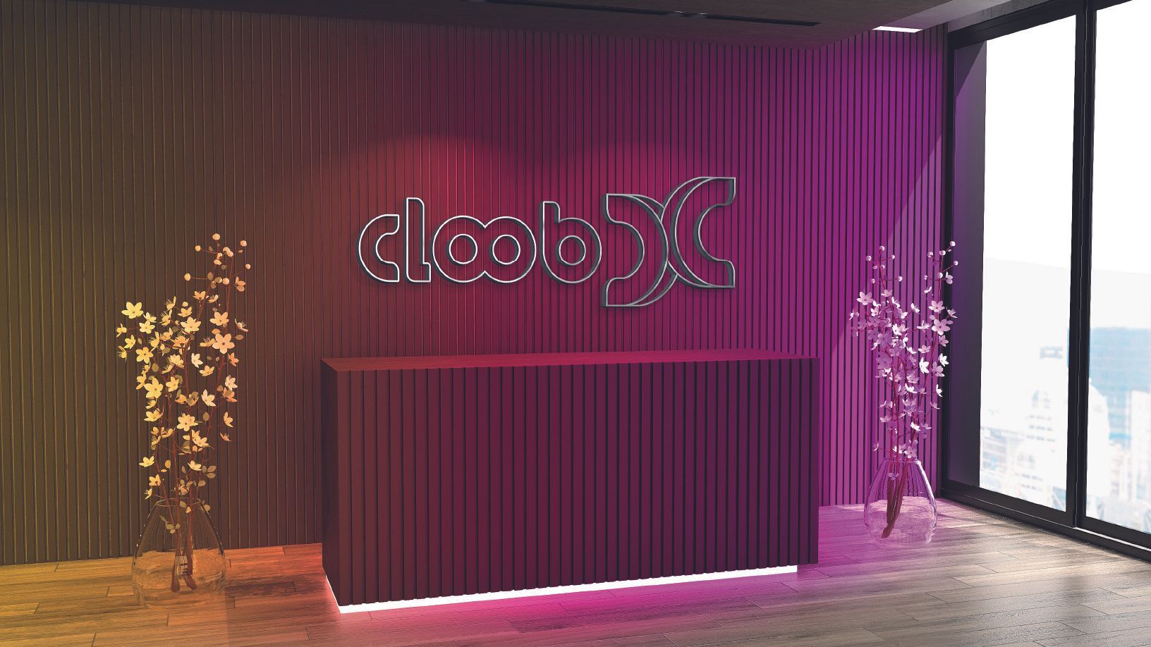 Área de recepção com balcão magenta, logotipo iluminado