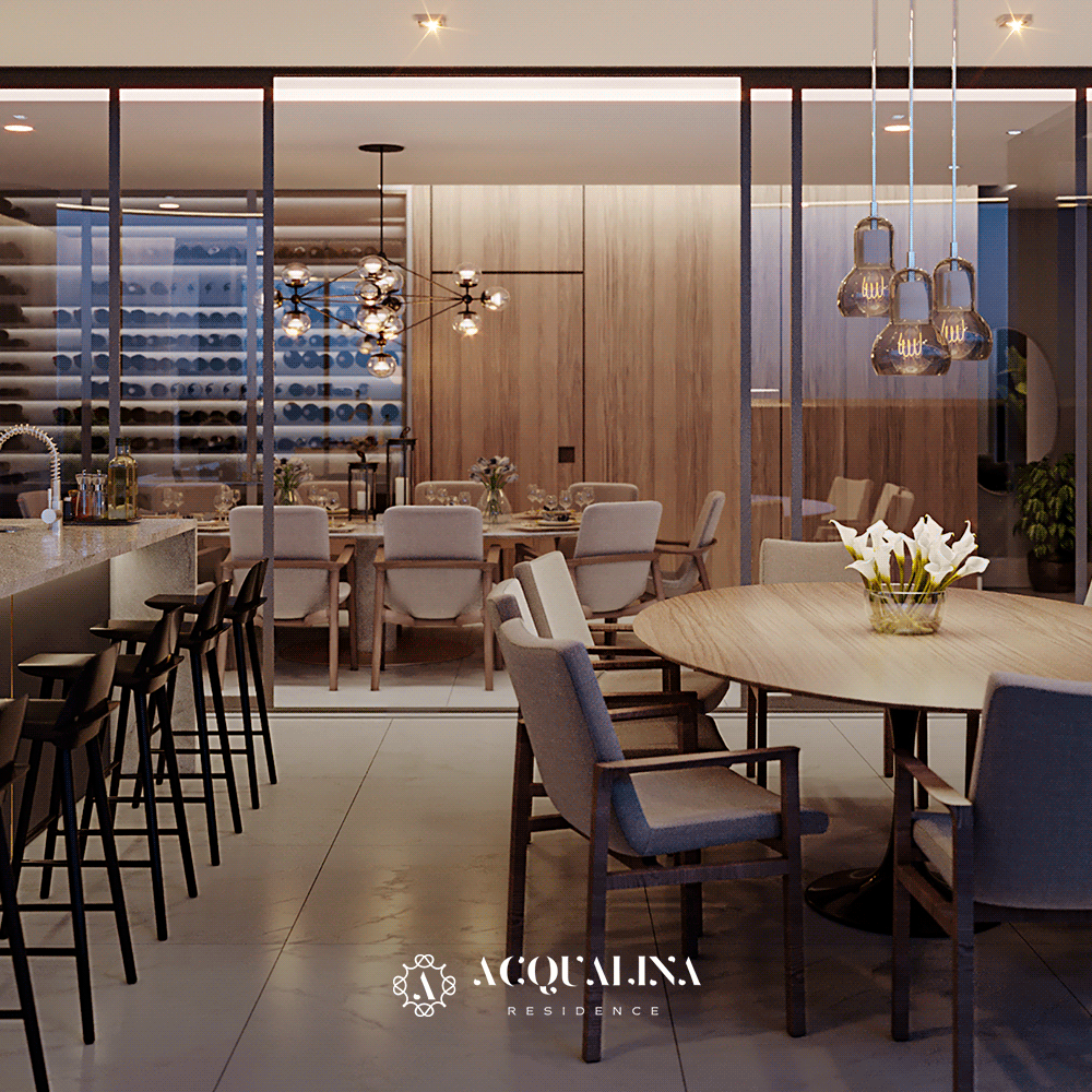 Um luxuoso espaço para refeições conta com uma mesa redonda com cadeiras, um bar e uma área de jantar formal separada com uma adega.