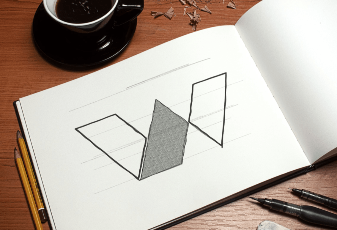 Um desenho em um caderno com uma xícara de café ao fundo