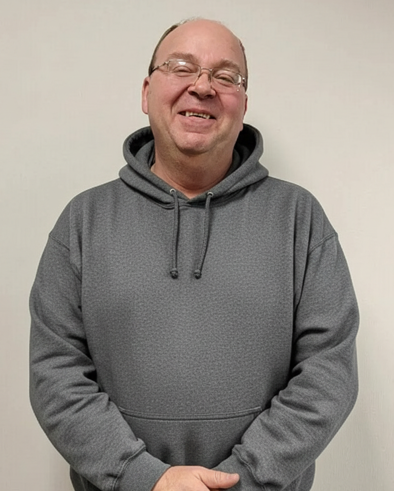 a man wearing a green hoodie with go on it