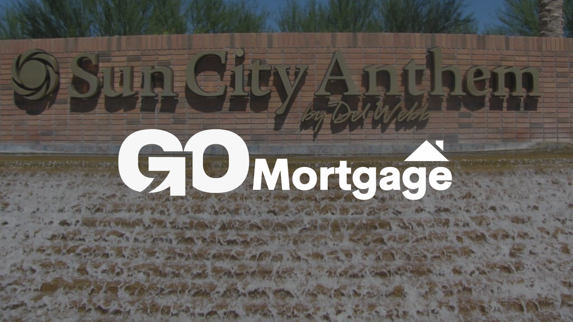 Anthem, Arizona sign with GO Mortgage logo, over water feature.