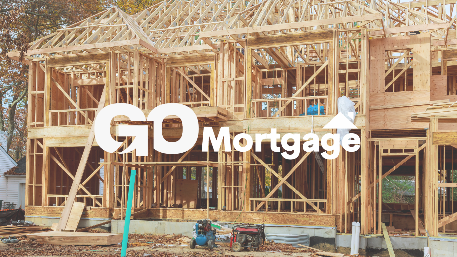 A house is being built with the words `` go mortgage '' written on it.