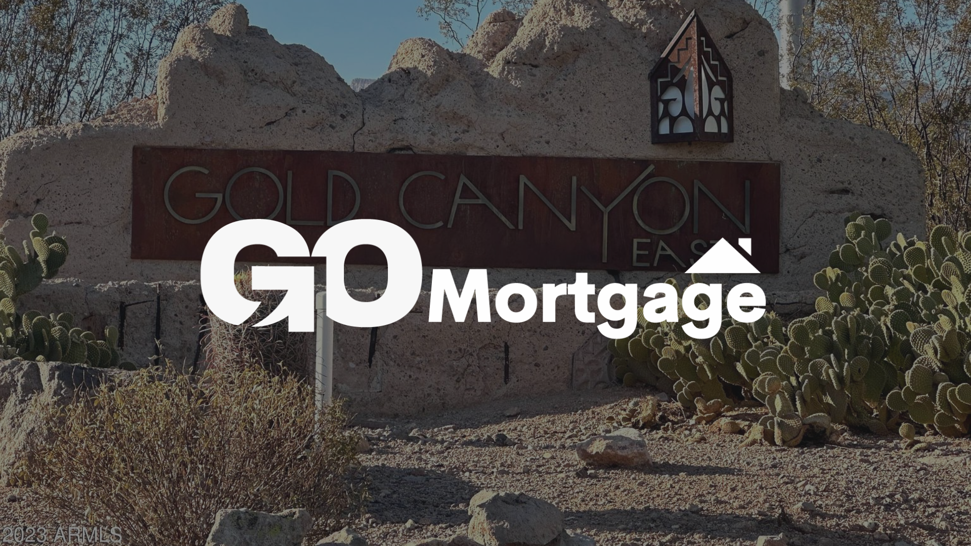 GO Mortgage logo over Gold Canyon East entrance sign.