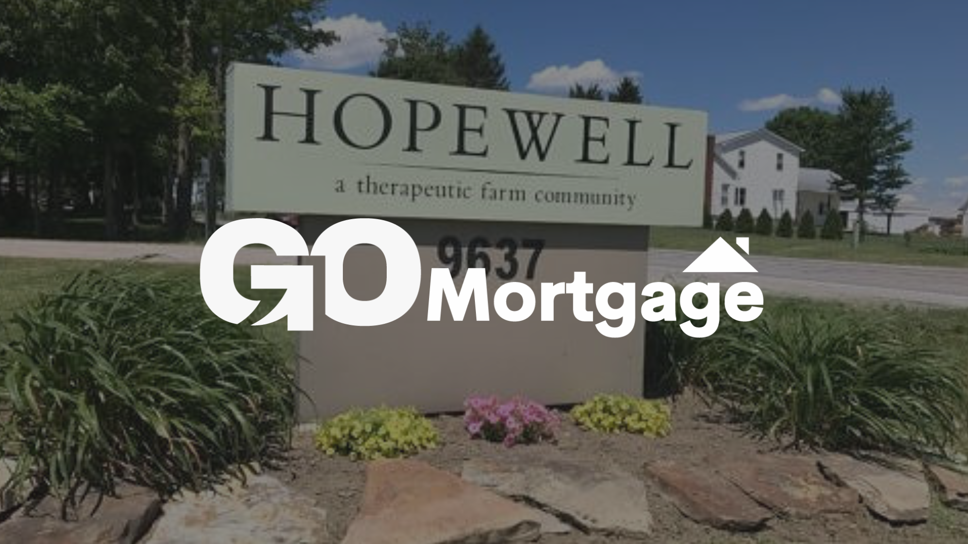 GO Mortgage logo overlaid on a sign for Hopewell,  OH