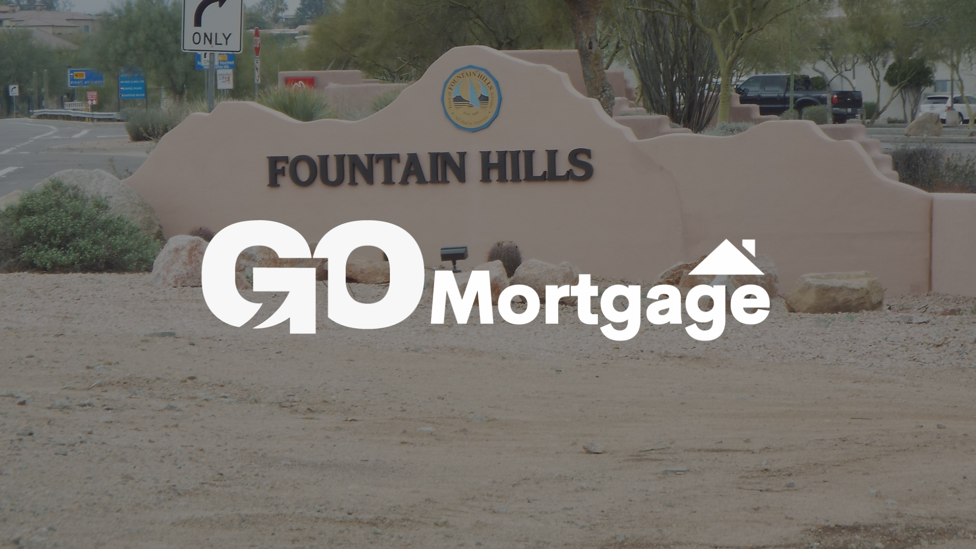 GO Mortgage logo overlaid on the Fountain Hills, AZ city sign.