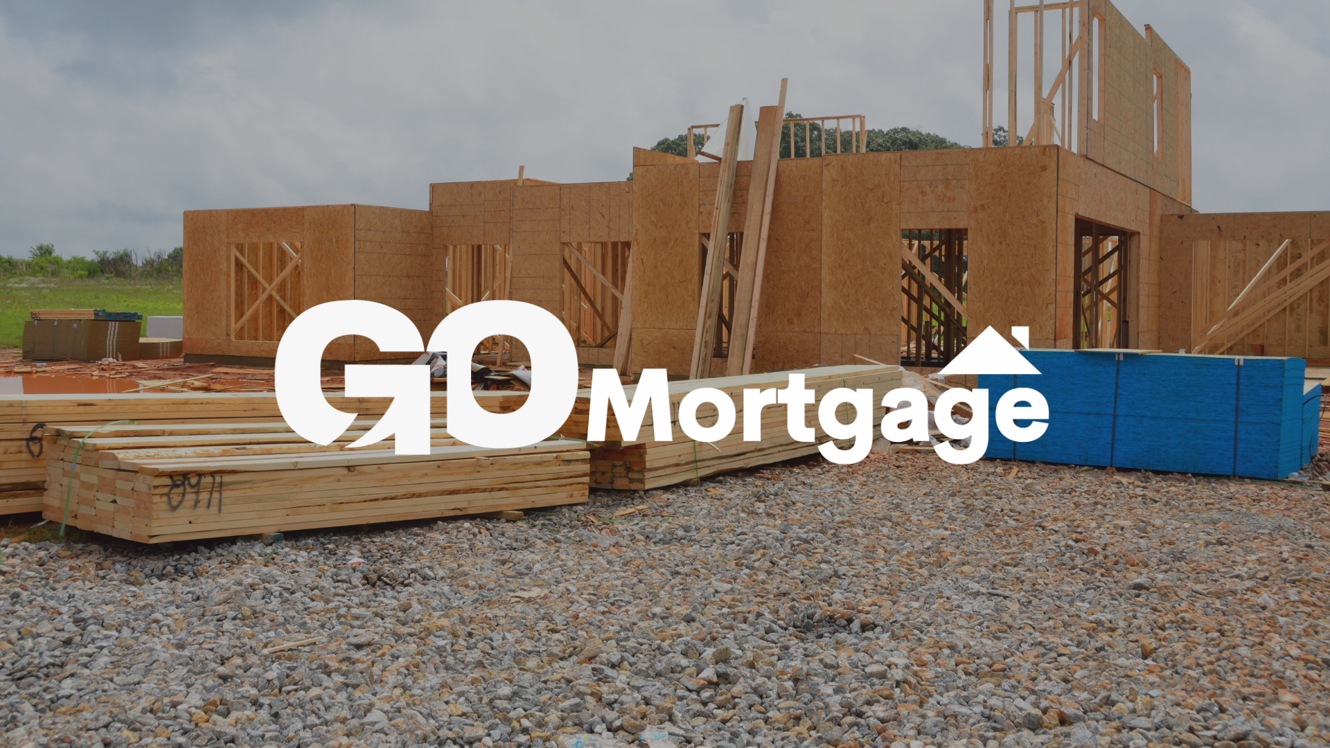 A house is being built with the go mortgage logo in the foreground.