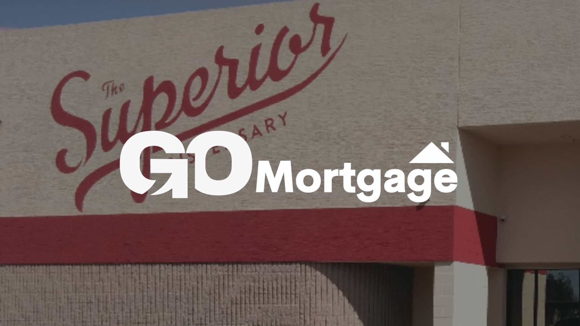 GO Mortgage logo overlaid on building with 