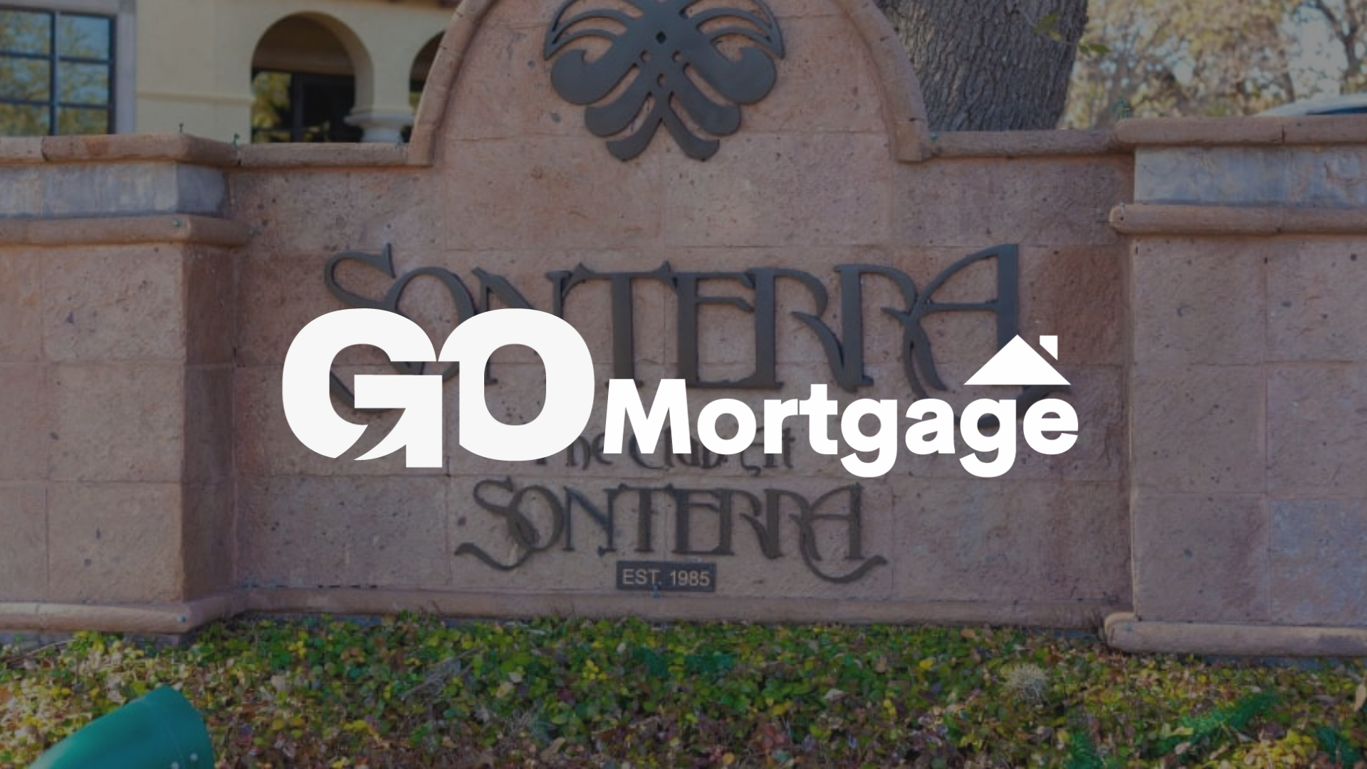 GO Mortgage logo overlaid on a Sonterra neighborhood entrance sign.