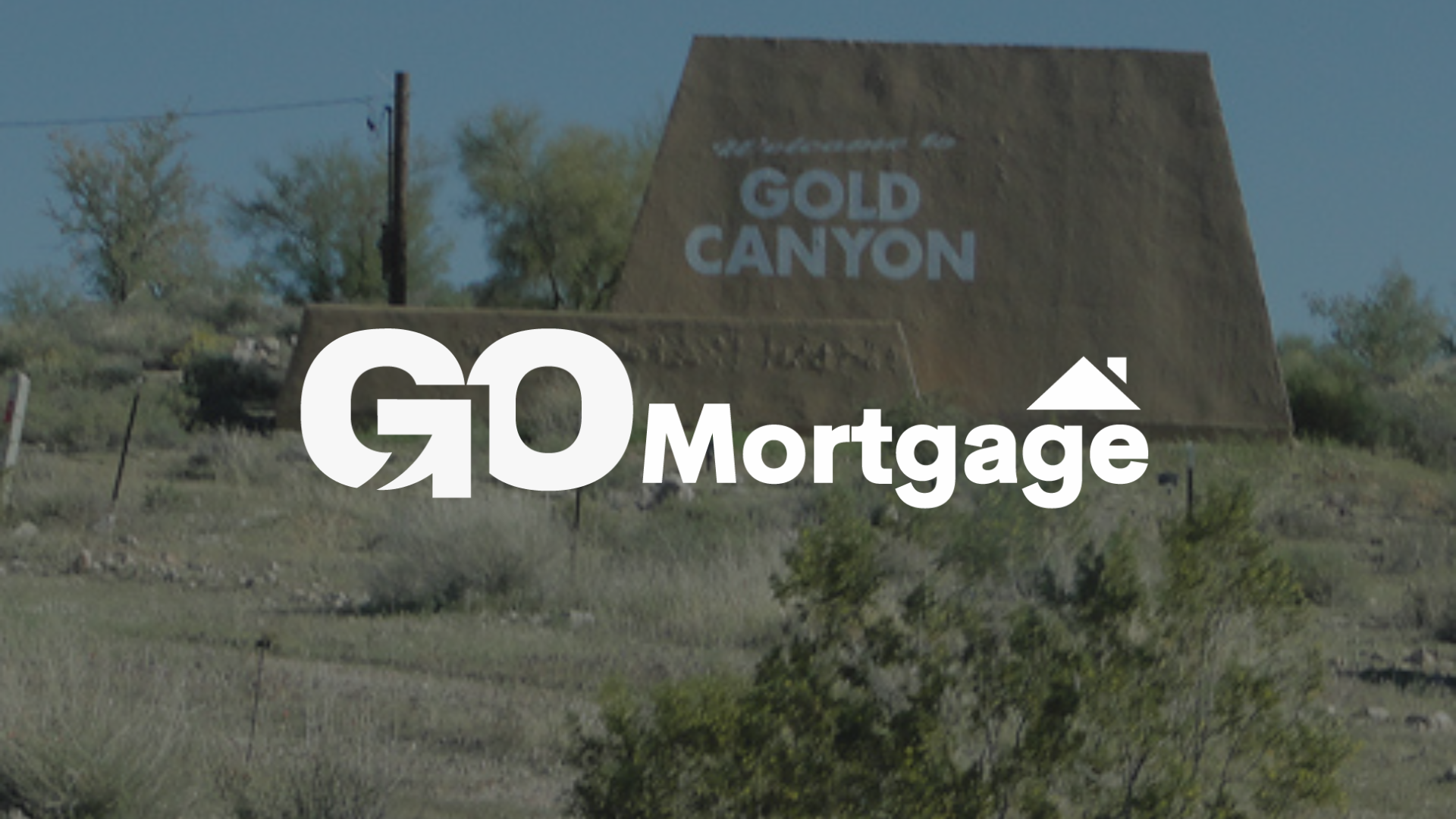 GO Mortgage logo in front of a Gold Canyon sign in a desert landscape.