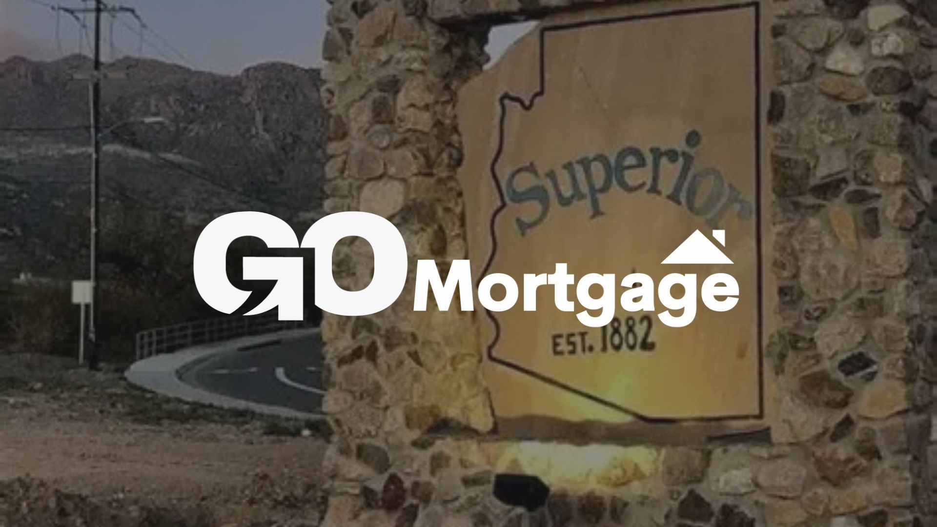 GO Mortgage logo with Arizona outline over a stone structure; mountainous background.