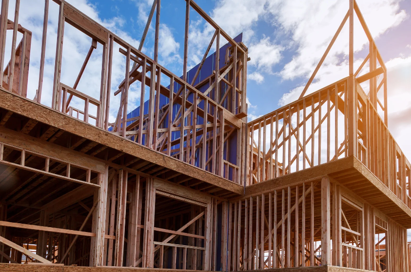 A house is being built with a lot of wooden frames.