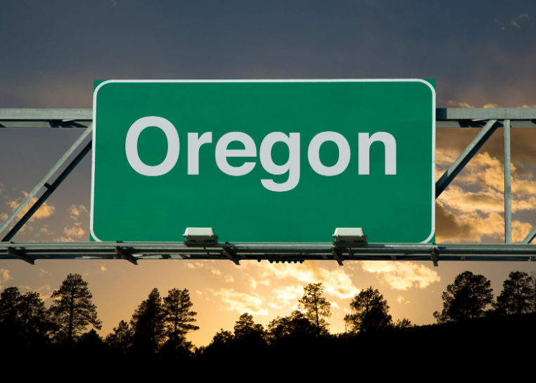 A green highway sign that says oregon on it