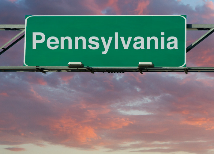 A green sign that says pennsylvania on it