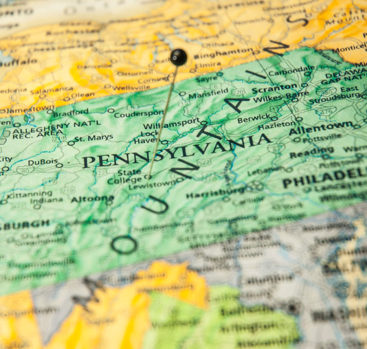 A close up of a map of pennsylvania with a pin on it.