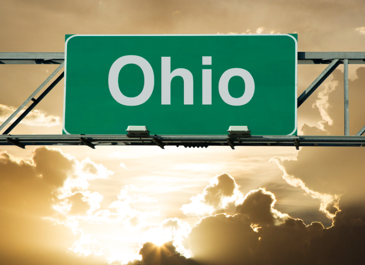 A green highway sign with the word ohio on it