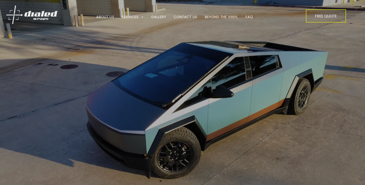 A tesla cybertruck is parked in a parking lot.