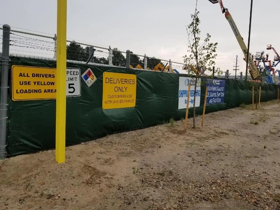 A fence with a sign that says delivery only on it