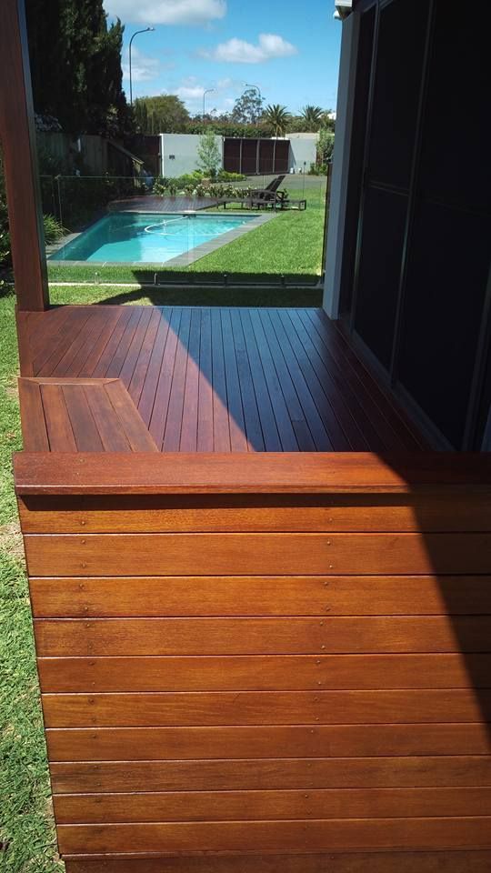 Wooden Deck With A Swimming Pool In The Background — Shane's Painting & Timber Restorations In Pittsworth, QLD