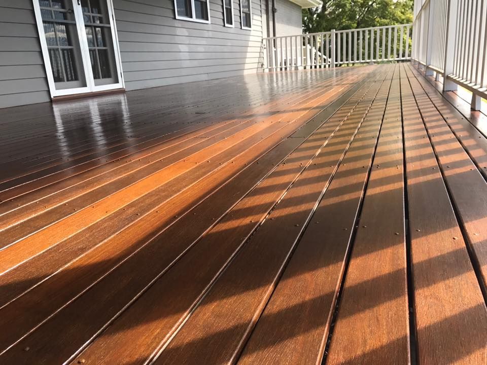 Wooden Deck With A White Railing And A House In The Background — Shane's Painting & Timber Restorations In Gatton, QLD