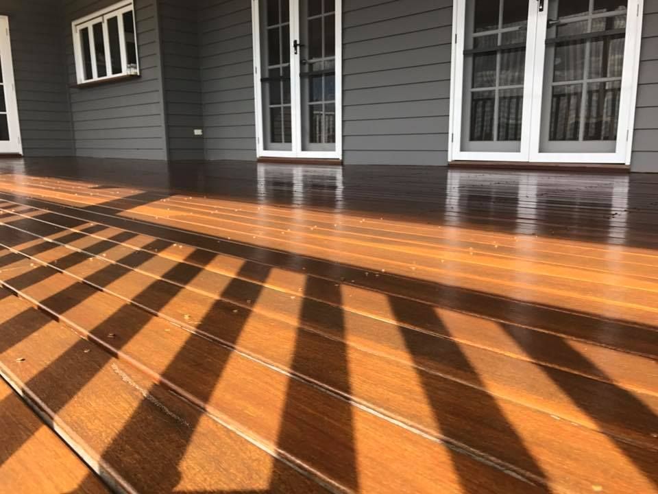 Sun Casting A Shadow On The Wooden Deck Of A House — Shane's Painting & Timber Restorations In Westbrook, QLD
