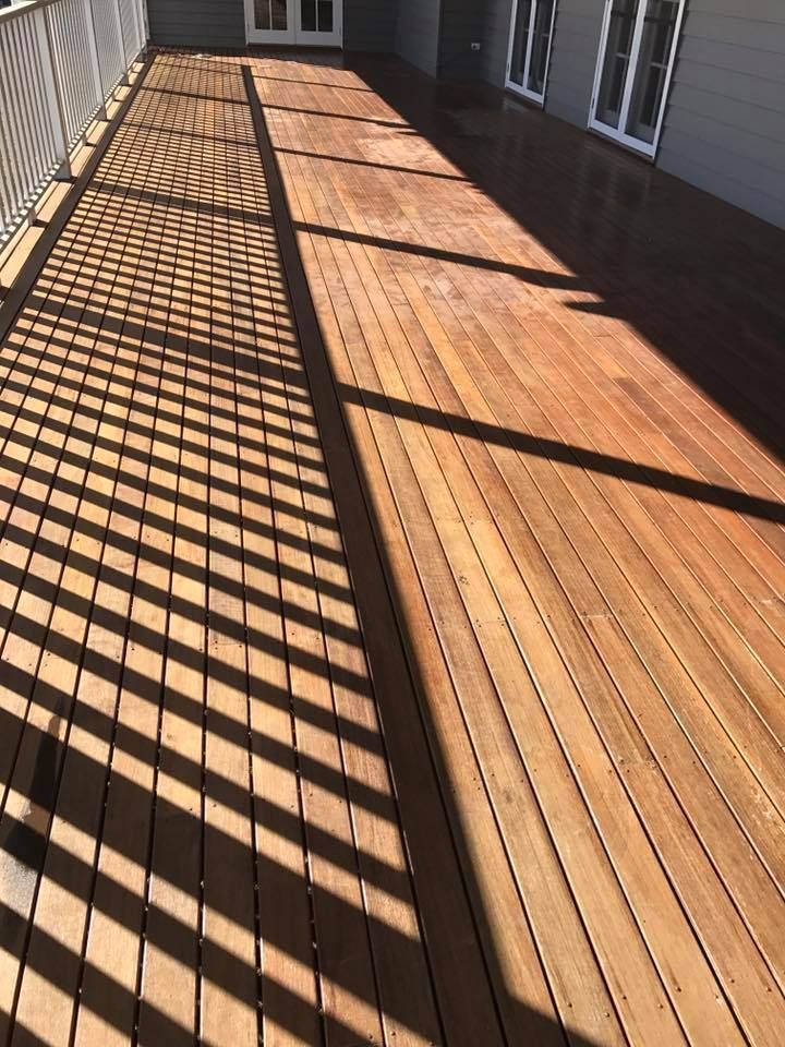Wooden Deck With A White Railing And Shadows — Shane's Painting & Timber Restorations In East Toowoomba, QLD