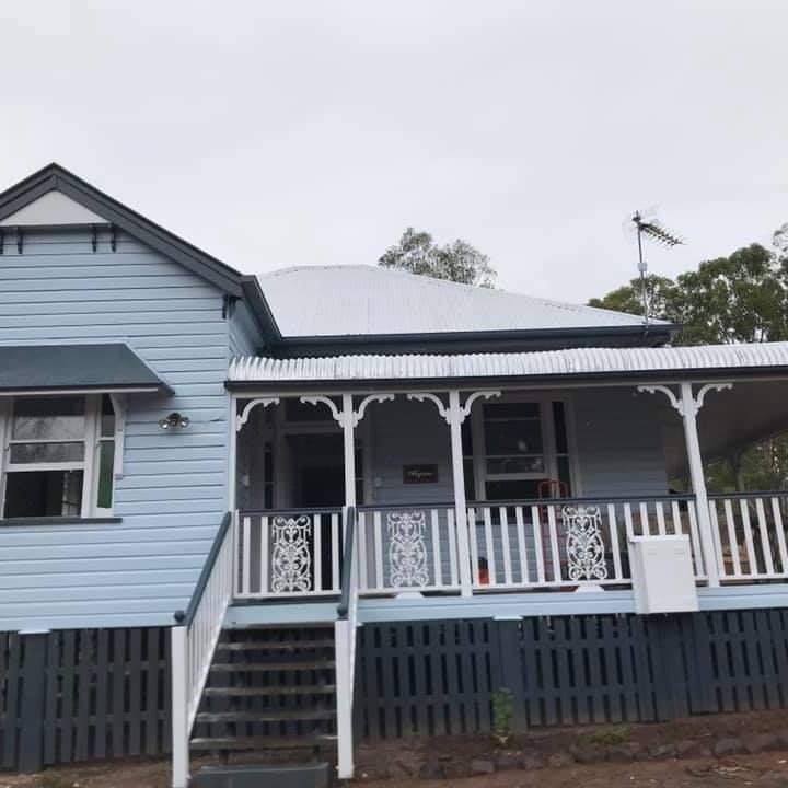 Blue House With A White Porch And Stairs — Shane's Painting & Timber Restorations In East Toowoomba, QLD