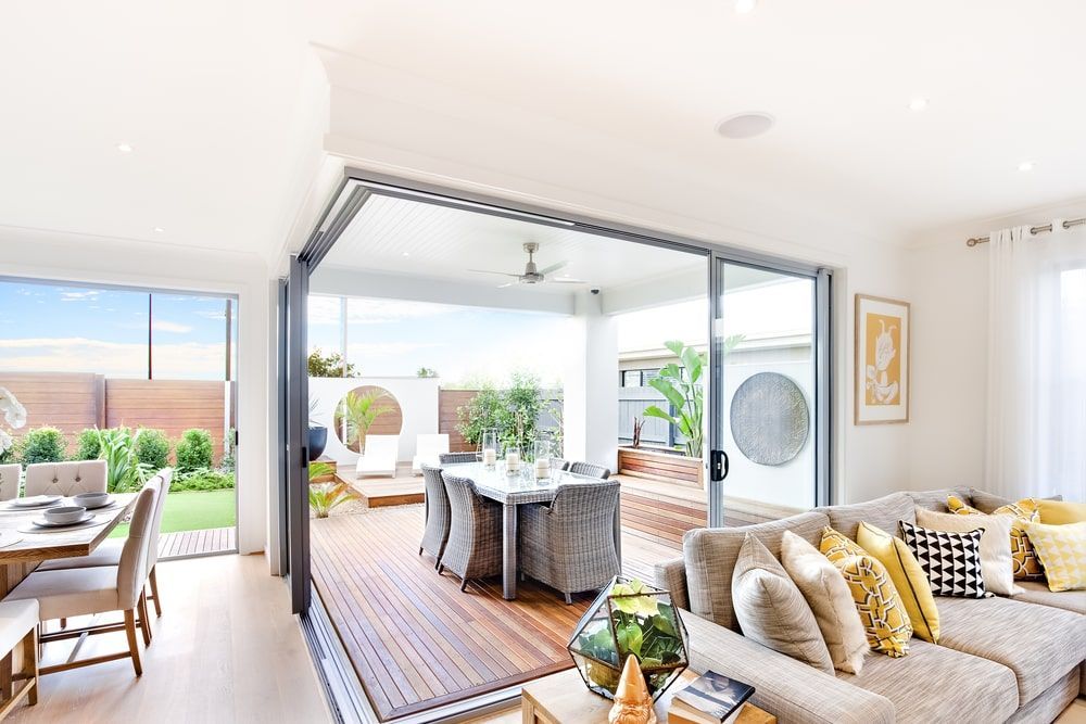 Living Room With A Wooden Deck And Sliding Doors On A Patio — Shane's Painting & Timber Restorations In East Toowoomba, QLD