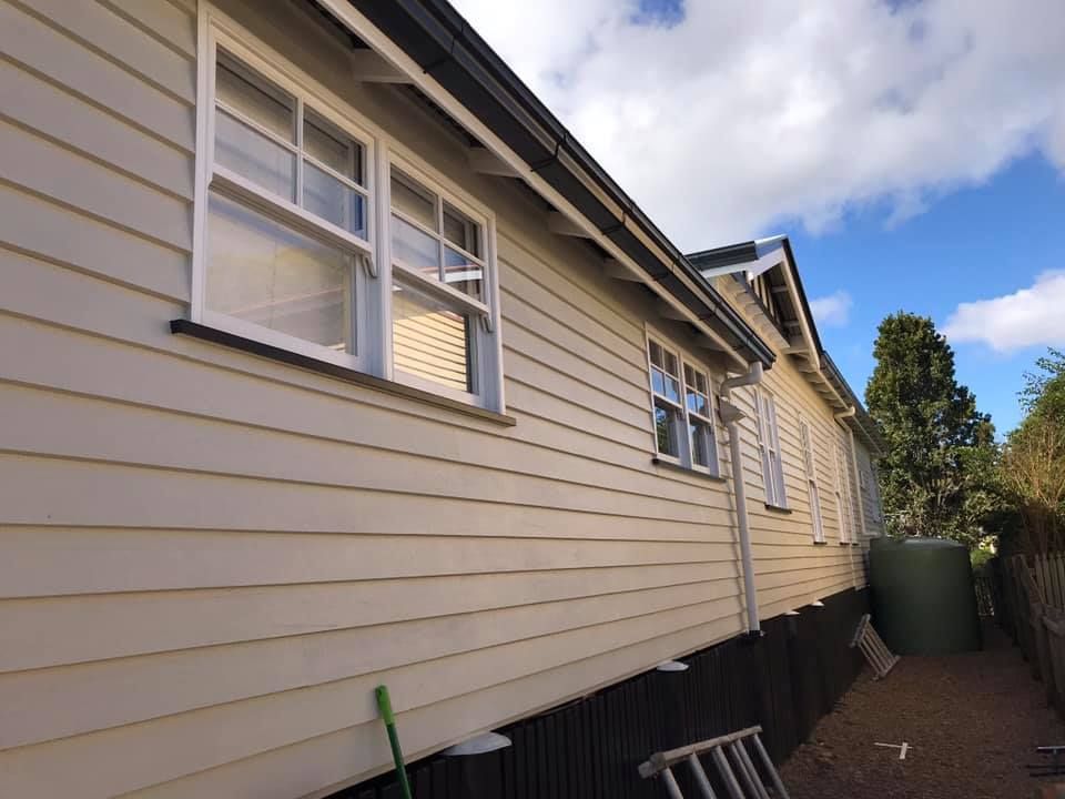 House With A Lot Of Windows And A Ladder In Front Of It — Shane's Painting & Timber Restorations In East Toowoomba, QLD