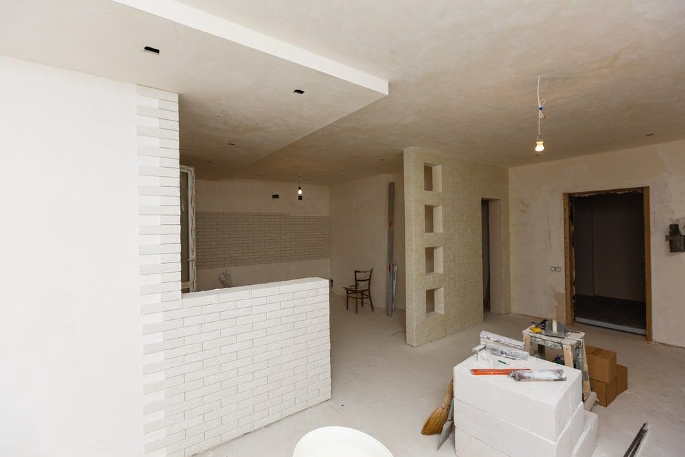 White Painted Walls And A Table With Tools For Renovation — Shane's Painting & Timber Restorations In East Toowoomba, QLD