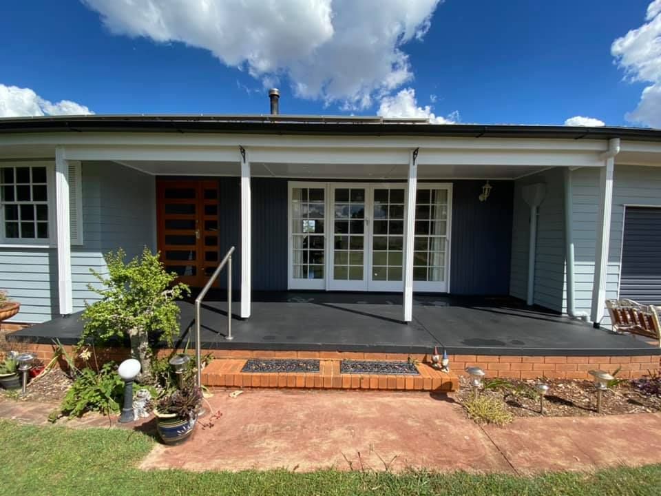 The Front Of A House With A Porch And A Brick Walkway — Shane's Painting & Timber Restorations In East Toowoomba, QLD