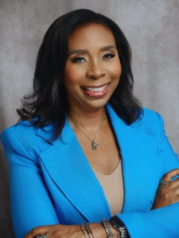 A group of men are standing around looking at a tablet.