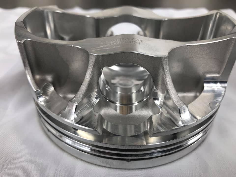 A close up of a piston on a white cloth