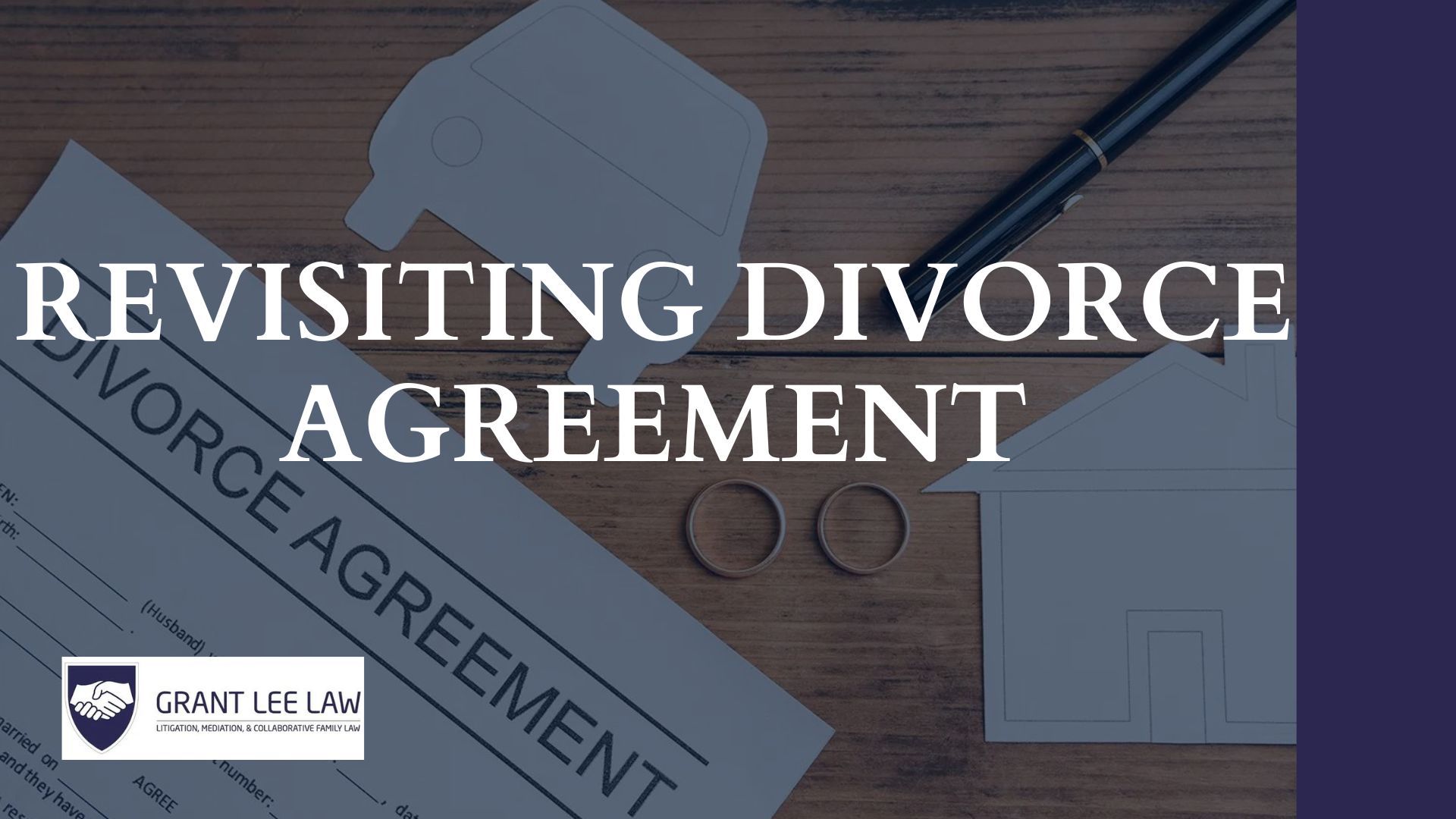 a divorce agreement is sitting on a wooden table next to a pen .