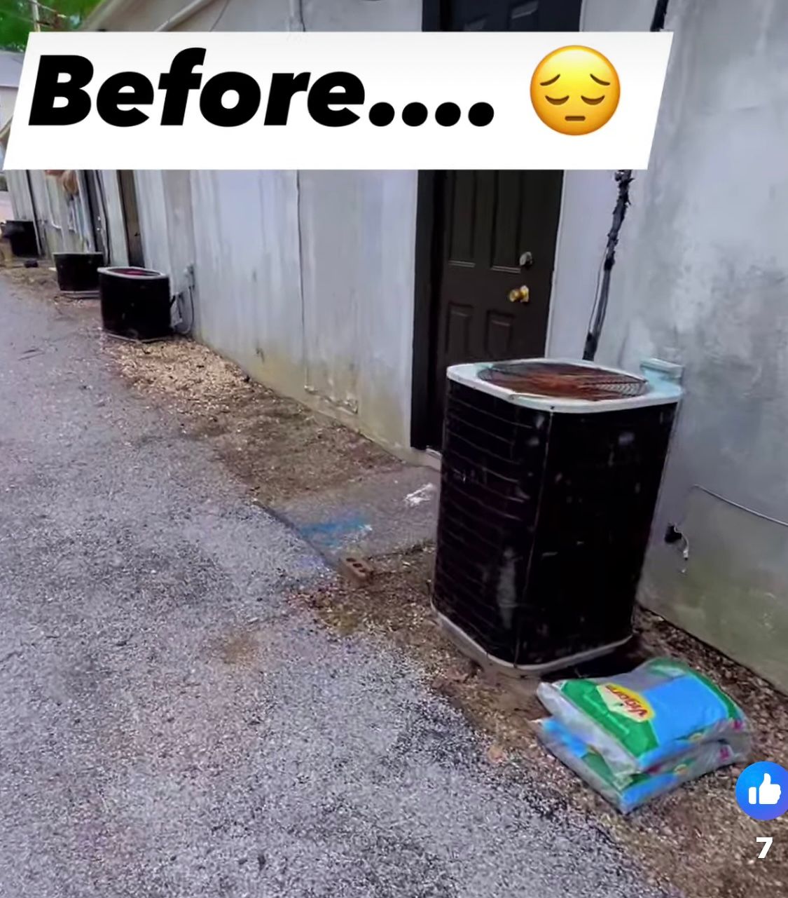 Black air conditioner unit outside, labeled