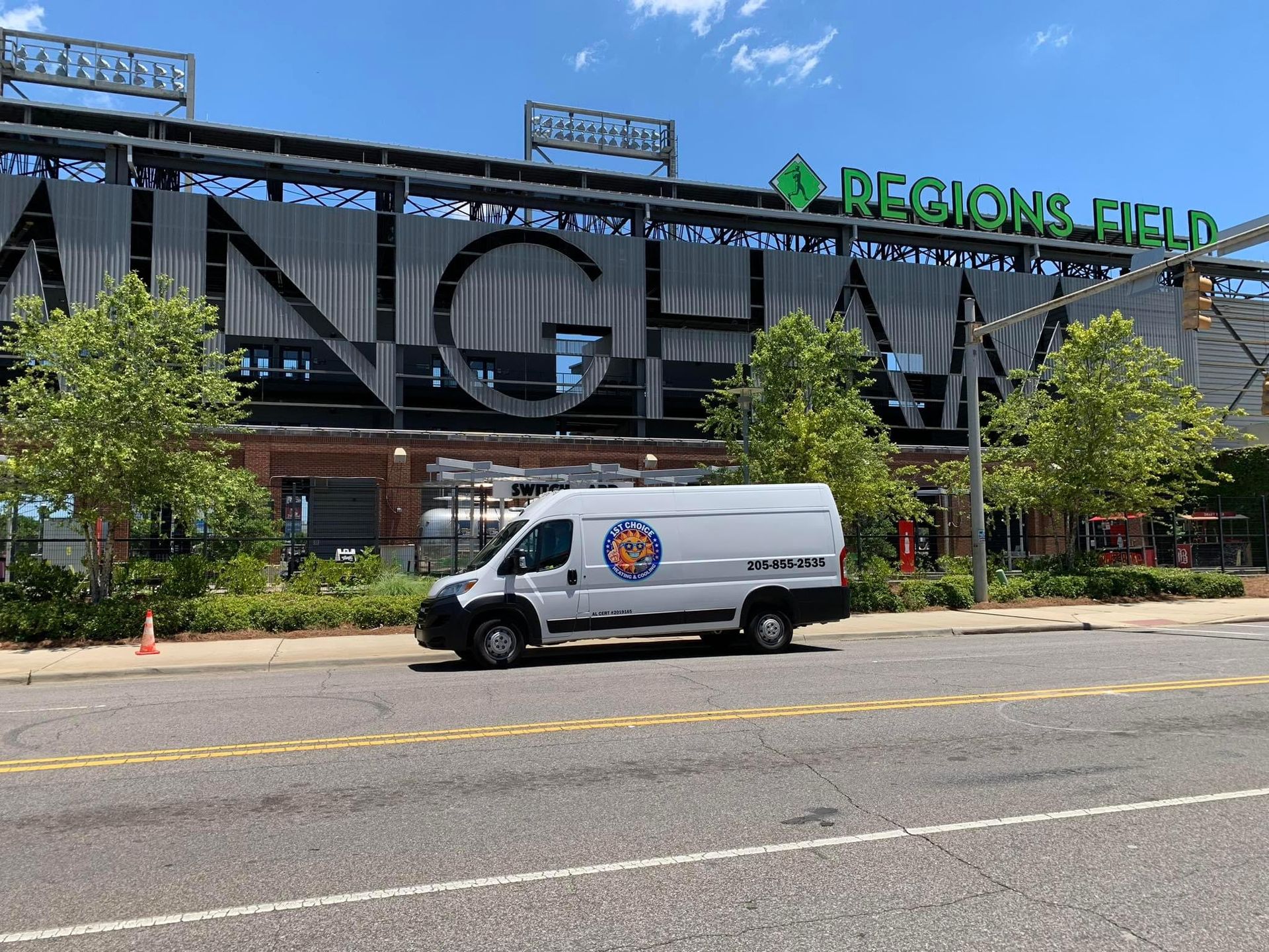 White service van parked in front of Regions Field baseball stadium in Birmingham, Alabama.