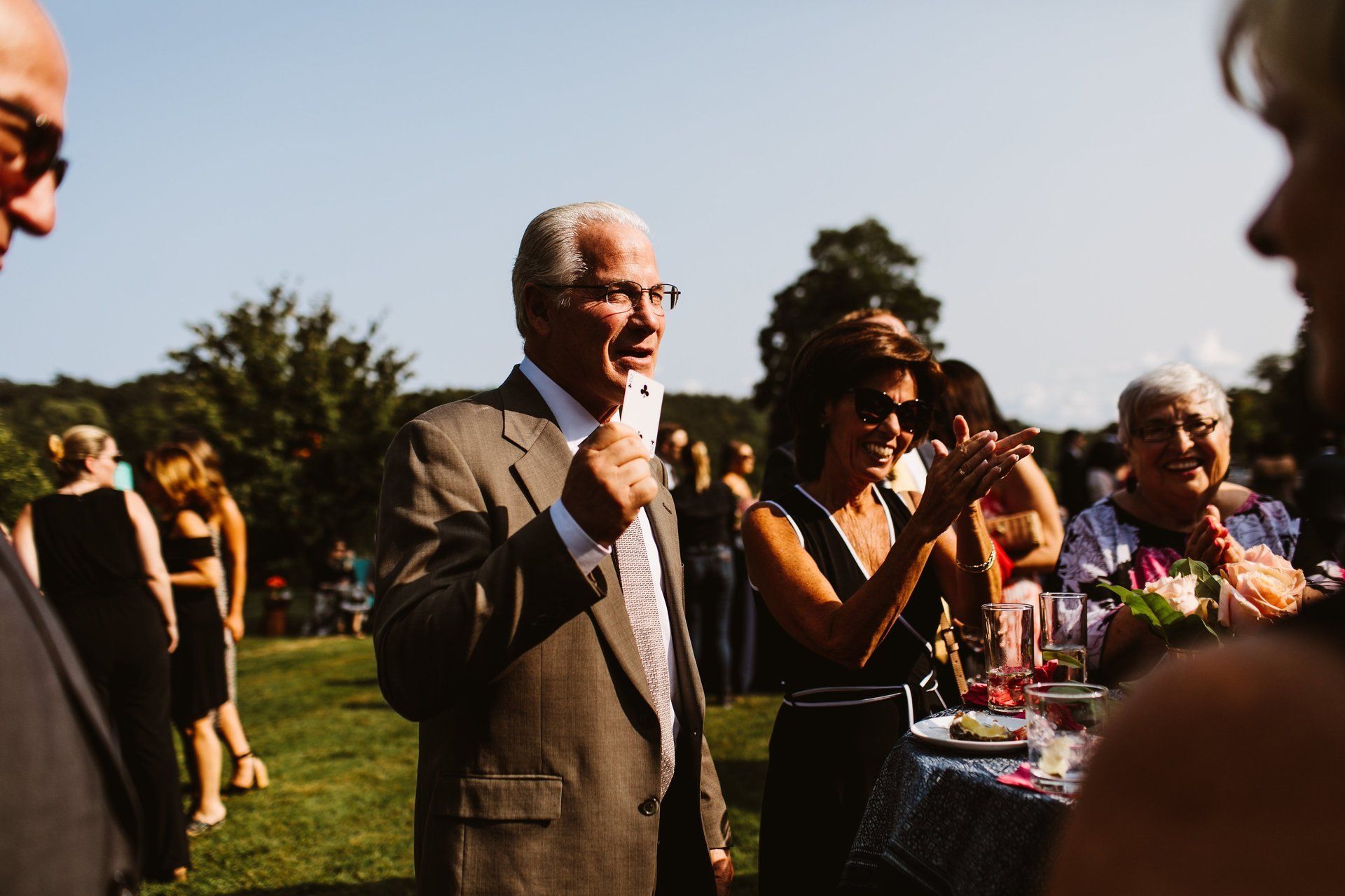 The father of the groom does a card trick
