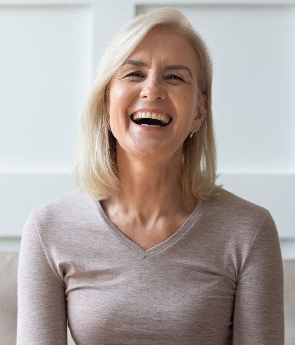 An older woman laughing