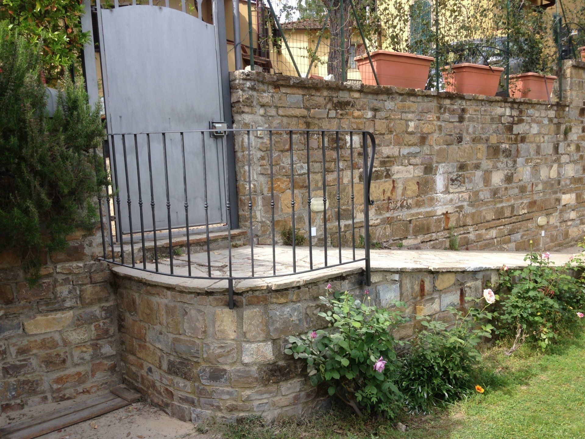 outdoor gate with wrought iron railing
