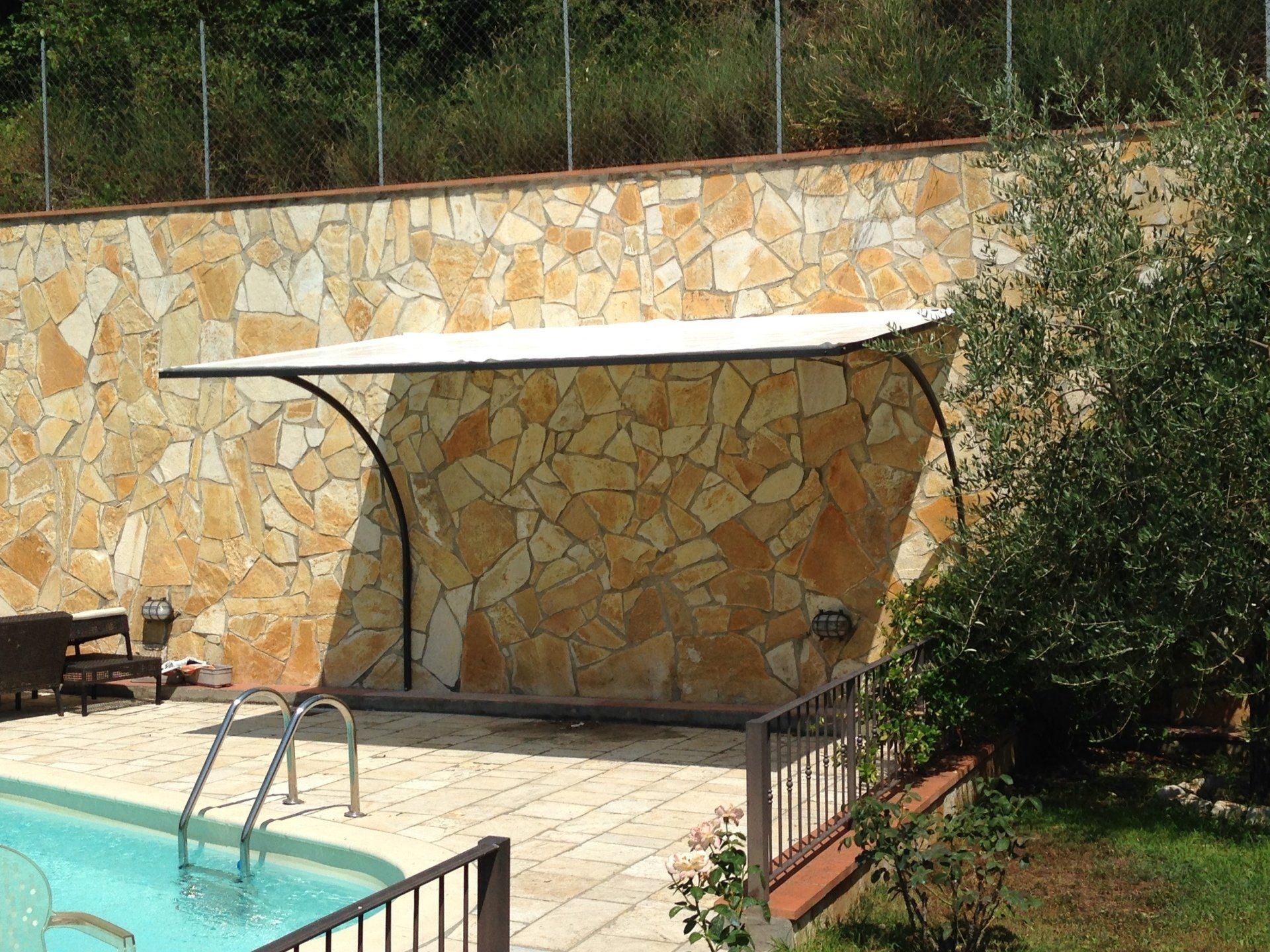 wrought iron and canvas canopy