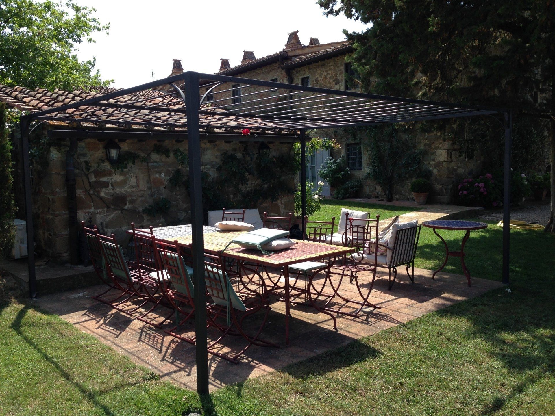 garden with wrought iron gazebo and accessories